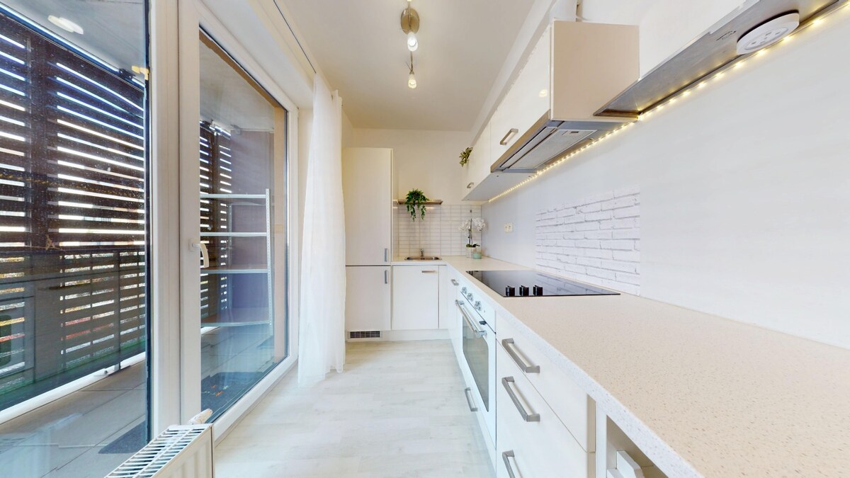 SLNEČNICE – VILADOMY | Svetlý 2-izbový byt s 25 m² terasou na predaj — foto 9